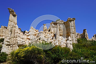 Orgues Ille sur Tet limestone chimneys stone in summer blue sky in site Languedoc Roussillon in France Stock Photo