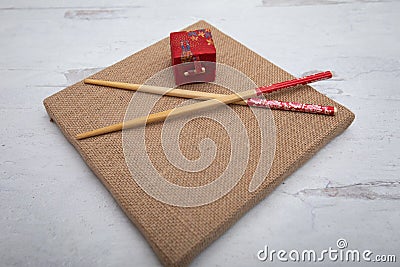 Oriental Asia inspired background chopsticks and Japanese gift box Stock Photo