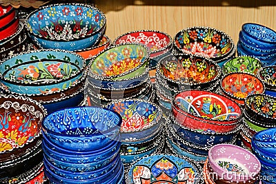 Oriental Colorful Ceramic Bowls for Sale on Grand Bazaar at Istanbul, Turkey, Tureens in Artisan Market close-up. Traditional Editorial Stock Photo