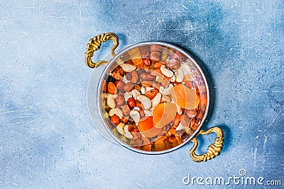 Oriental copper plate with mixed nuts Stock Photo