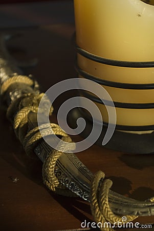 Oriental decorative artifacts - dagger and candle Stock Photo