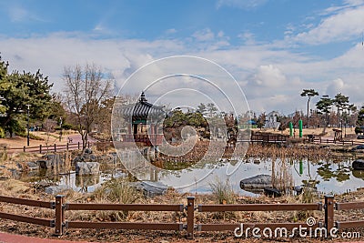 Oriental gazebo next to small pond Stock Photo