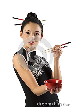 Oriental girl with chopstick Stock Photo