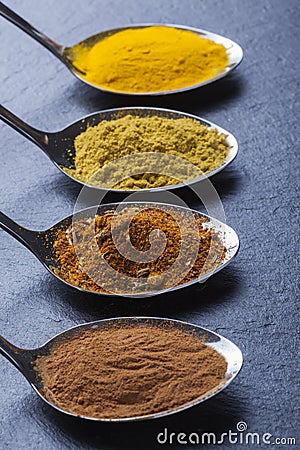 Oriental indian spices curry paprika nutmeg on slate Stock Photo