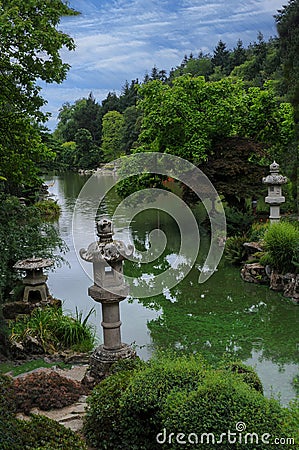 Oriental park with wunderful trees and stone lamps Stock Photo