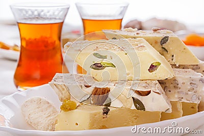Oriental sweets halva and tea Stock Photo