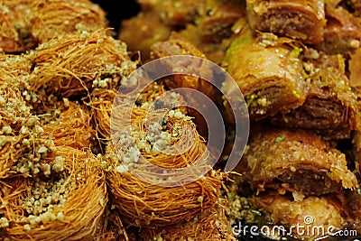 Oriental sweets made from nuts, honey and dough of different shapes and colors. Handmade oriental sweets on the market in Jerusale Stock Photo