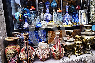 Oriental,Turkish,Azerbaijani ,vintage,silver, ceramic iron dishes for sale . Old kitchenware trays, teapots, coffee turks samovars Editorial Stock Photo