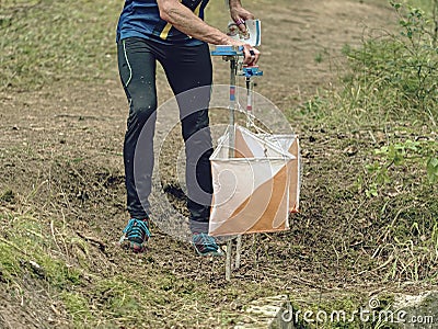 Orienteering control point in a forest, popular sport activities Stock Photo