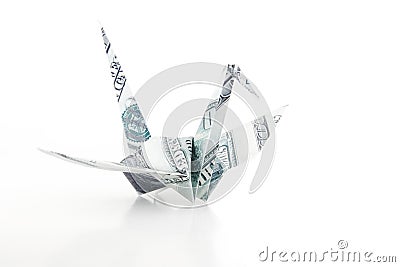 The Origami bird made from the dollar bank note Stock Photo