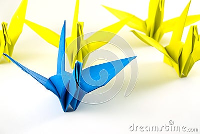 Origami birds demonstrate think different concept. Stock Photo