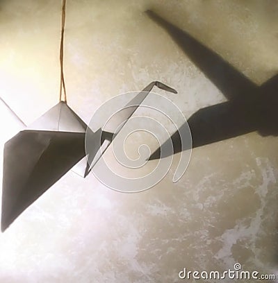 Origami crane with shadow. Nice abstract background Stock Photo