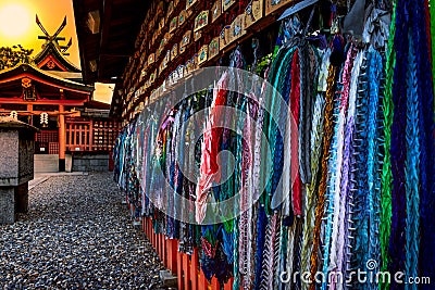 Origami cranes and prayer tablets at Fushimi Inari Shrine in Kyoto, Japan Editorial Stock Photo