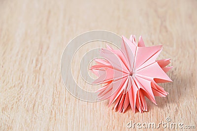 Origami flower on wood Stock Photo