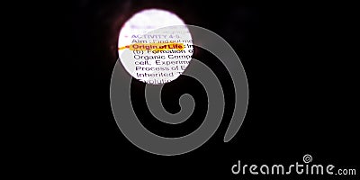 origin of life word displayed on centralize pattern on a dark circles Stock Photo