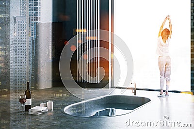 Original bathroom, tub in floor, woman Stock Photo