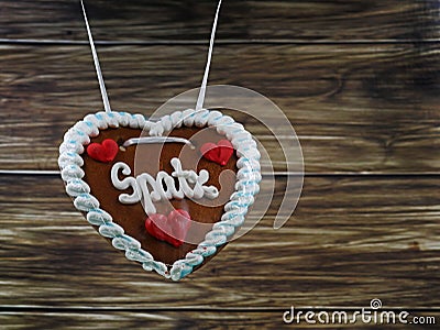 Original bavarian gingerbread heart with german pet name ,Spatz, from Munich, Oktoberfest on wooden background Stock Photo