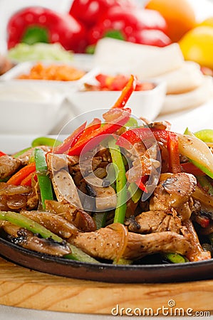 Original fajita sizzling hot on iron plate Stock Photo