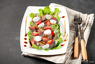 Original meat, strawberry and mozzarella salad Stock Photo