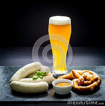 Original Munich sausage with Hefeweizen and pretzel Stock Photo