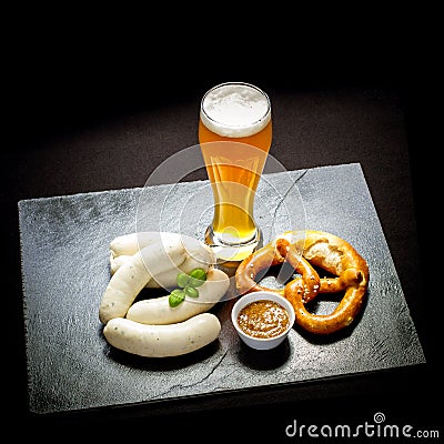 Original Munich sausage with Hefeweizen and pretzel Stock Photo