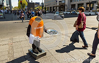 Original orange robot bin in Berlin, Germany. Editorial Stock Photo