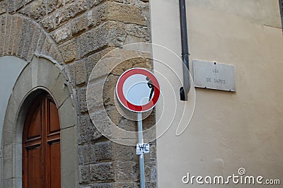 Original road signs in Florence, Italy. Social art of the artist Clet Abraham. Attracts the attention of drivers and tourists. Editorial Stock Photo