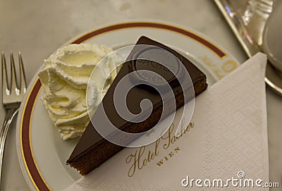 Original Sacher Torte served with whipped cream Editorial Stock Photo