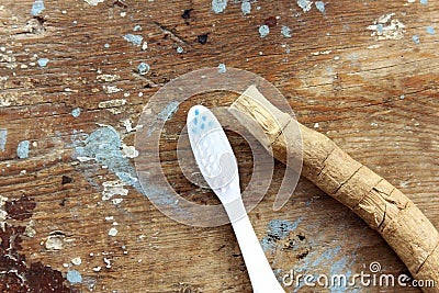 Original toothbrush miswak with modern toothbrush Stock Photo