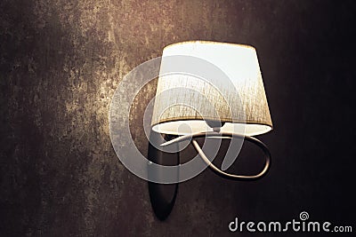 Original white lamp, sconce on a brown wall in vintage style Stock Photo