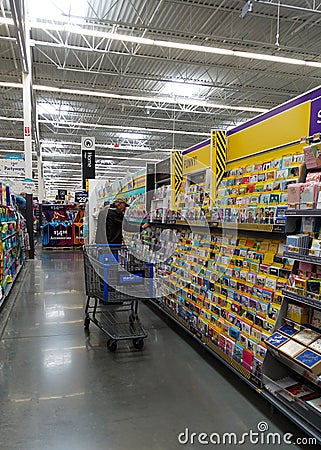 An elderly senior man picking out a greeting card Editorial Stock Photo