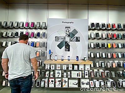 An Apple store display of Photography Accessories for customers to purchase Editorial Stock Photo