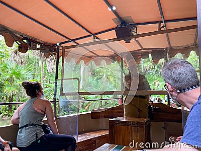 A cast member aboard a Jungle Cruise ride boat in the Magic Kingdom at Walt Disney World Resorts in Orlando, FL Editorial Stock Photo