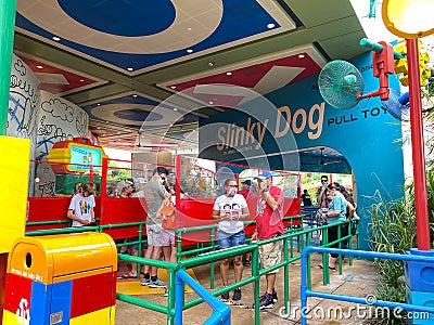 The people waiting in line at the Slinky Dog Dash roller coaster ride in Toy Story Land Editorial Stock Photo