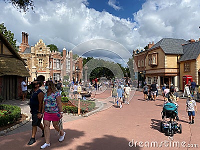 People walking around the England area of the World Showcase in EPCOT Editorial Stock Photo