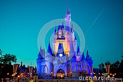 Panoramic view of illuminated Cinderella`s Castle on blue night background in Magic Kingdom at Walt Disney World 1 Editorial Stock Photo