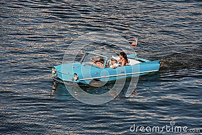 Water Taxi , Blue Vintage Car, Funny People. Editorial Stock Photo