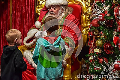 Funny brothers talking with Santa Claus at Seaworld 36. Editorial Stock Photo
