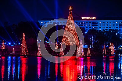 Illuminated and colorful Sea of Christmas Trees and partial view of Reinassance Hotel at Seaworld 9. Editorial Stock Photo