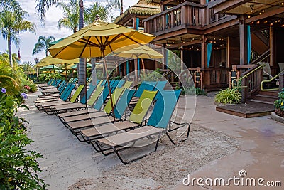 Colorful beach chairs and cabanas at Volcano Bay in Universal Studios area Editorial Stock Photo