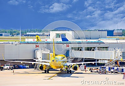 View of airplanes from Spirit Airlines NK at the gate in Orlando International Airport MCO Editorial Stock Photo
