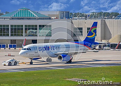 View of airplanes from Spirit Airlines NK at the gate in Orlando International Airport MCO 2 Editorial Stock Photo