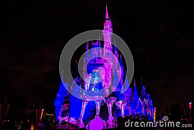 Illuminated and colorful Cinderella Castle in One Upon a Time Show at Magic Kingdom 9. Editorial Stock Photo
