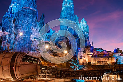 Partial view of Millennium Falcon and blue mountains in Star Wars Galaxys Edge at Hollywood Studios 106 Editorial Stock Photo