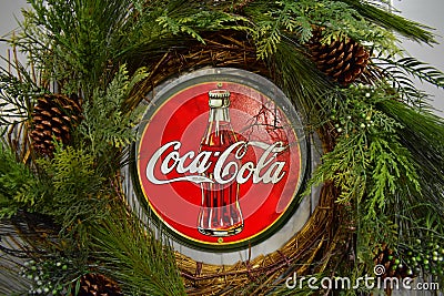 Vintage Coca Cola poster with Christmas decorations in International Drive area. Editorial Stock Photo