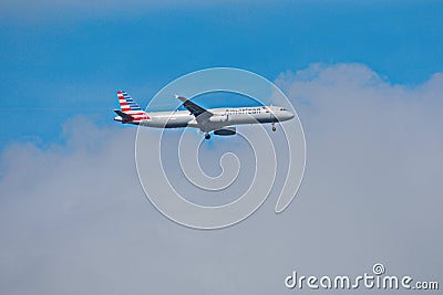 Airplane from American Airlines, at Orlando Airport . The background of the image makes it a ty Editorial Stock Photo