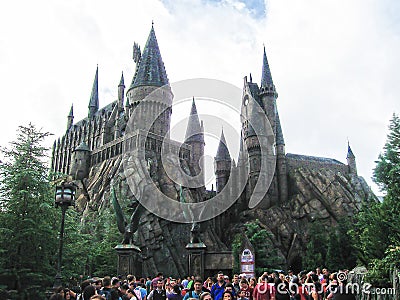 Orlando, USA - January 02, 2014: Visitors enjoying the Harry Potter themed attractions and shops at the Hogsmeade Editorial Stock Photo