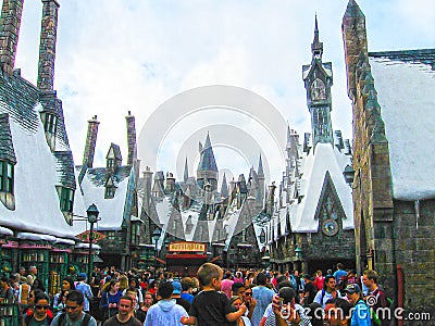 Orlando, USA - January 02, 2014: Visitors enjoying the Harry Potter themed attractions and shops at the Hogsmeade Editorial Stock Photo