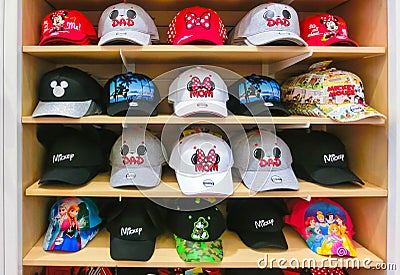 Orlando, USA - May 10, 2018: The colorful baseball caps at Disney store indoor shopping mall Orlando premium outlet at Editorial Stock Photo