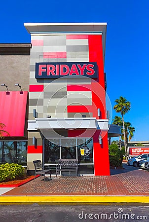 Orlando, USA - May 8, 2018: TGI Fridays exterior and logo. TGI Friday`s is an American restaurant chain focusing on Editorial Stock Photo